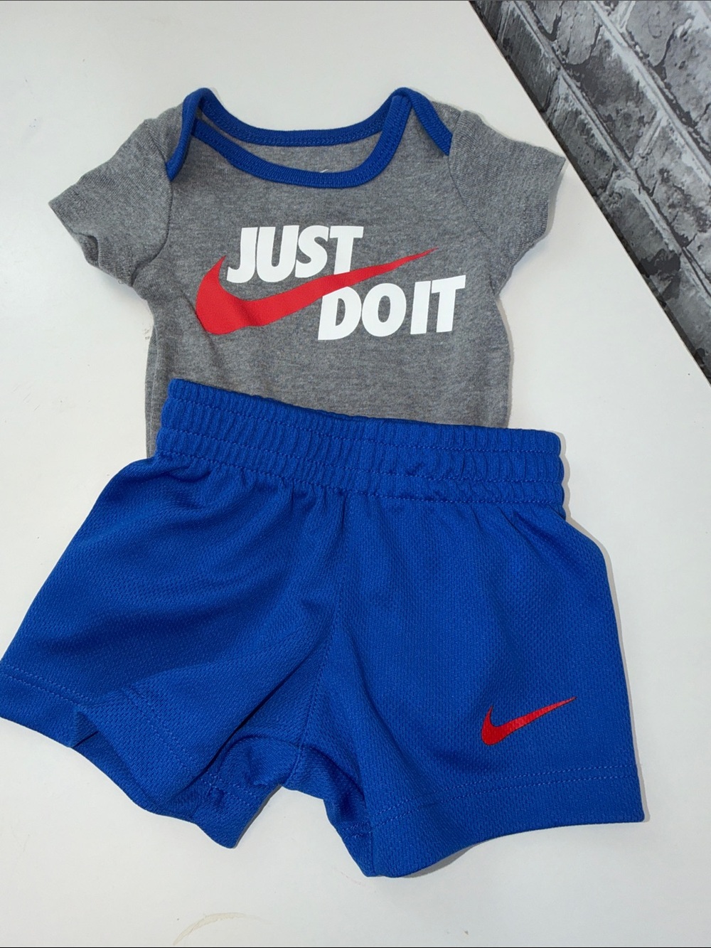 Baby boy's‎ Nike Gray Bodysuit with Blue Shorts and Red Swoosh